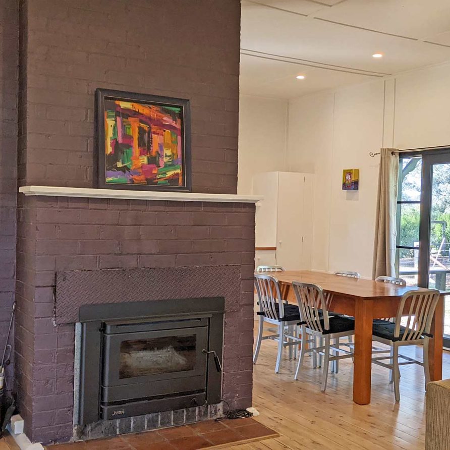 Main area with fireplace and dining table